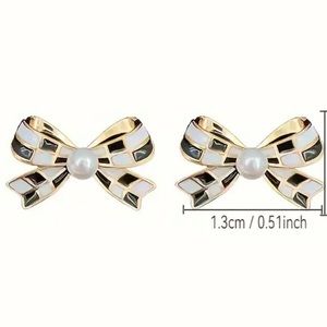 Checkerboard Bow Stud Earrings New in packaging. Gold trim.‎